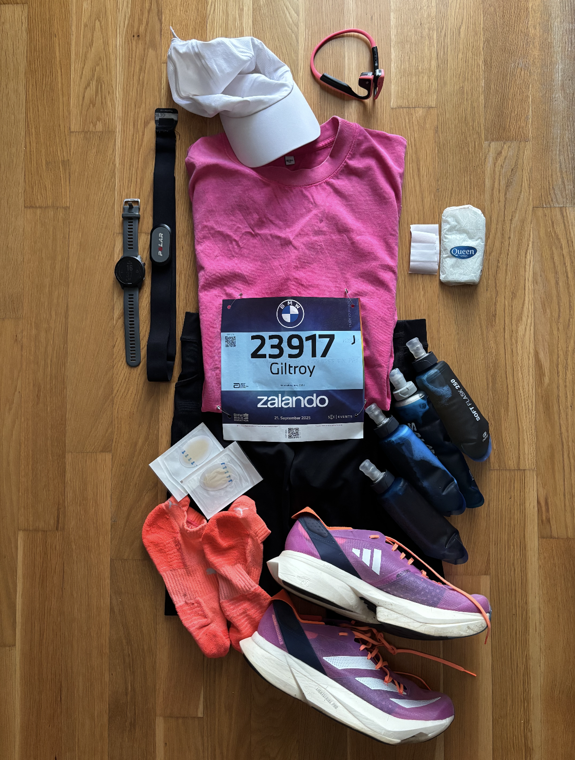 Flatlay photo of my running clothes and other gear for the marathon